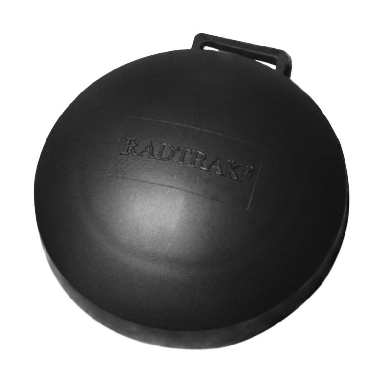 A single Radtrak2 long term radon test kit for testing a home, school or business. The detector is round and black and is about the size of a puck and 2cm thick.